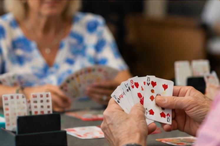 two women playing cards